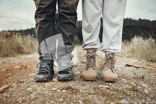 Image of Feet, hiking and couple on mountain road with travel, holiday and adventure together outdoor. Shoes, journey and climbing in nature with walking, fitness and wellness for trekking with people