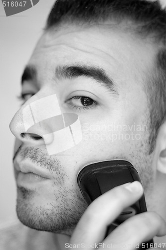 Image of Young Man Shaving