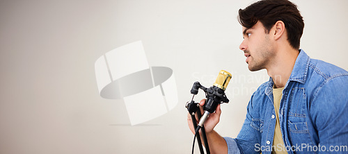 Image of Man, mic and podcast, influencer and media with broadcast, mockup space and communication. Talk show, chat and live streaming with presenter or speaker, interview and platform with wall background