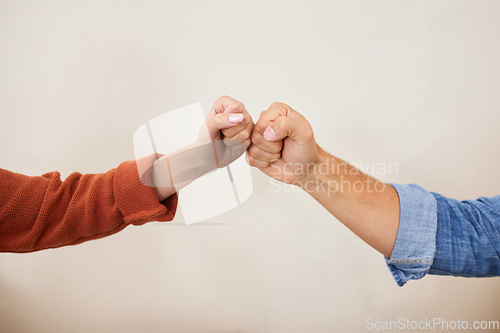 Image of Fist bump, partnership and hands, people in a team with support, celebration and hello, success and solidarity. Synergy, cooperation and trust, agreement and deal with handshake and wall background