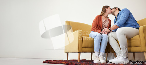 Image of Couple on a couch, kiss and love with marriage, relationship and mockup space moment, romantic and trust. People on a sofa, man and woman with connection, care and dating with commitment and relax