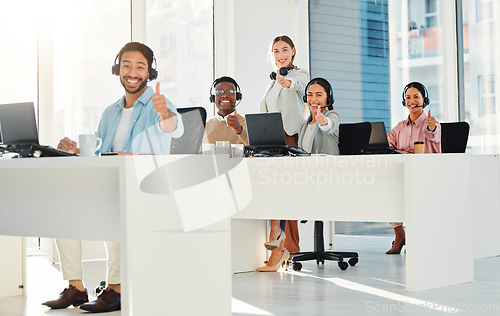 Image of Call center staff, group and thumbs up in portrait with laptop, telemarketing and teamwork with voip tech. Help desk, people and customer service with contact us, emoji and feedback for consulting