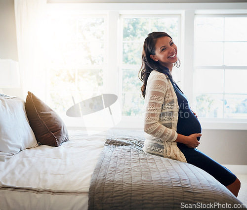 Image of Home bed, happiness and woman pregnancy, massage stomach and mom happy for baby support, development or care. Expectation, bedroom flare and pregnant mother smile, love and relax on maternity leave