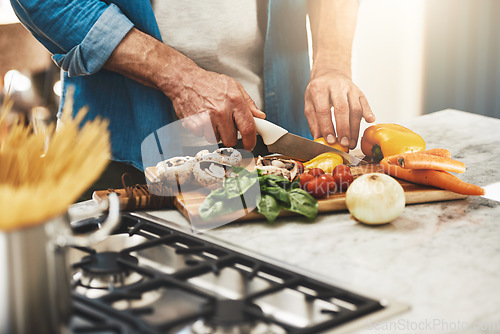 Image of Cooking, hands and man cutting vegetables in the kitchen for diet, healthy or nutrition dinner. Recipe, closeup and mature male person from Canada chop ingredients for a supper or lunch meal at home.