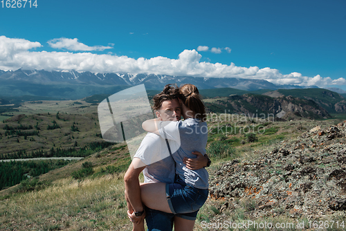 Image of Loving couple together on mountain