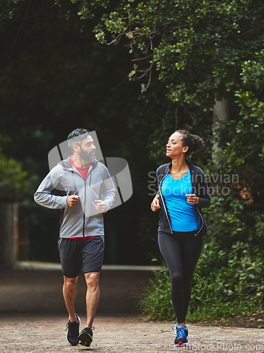 Image of Couple, running in park for exercise and health outdoor, support and training for marathon with cardio. Runner, athlete and sport with people in nature, challenge and fitness with workout for race