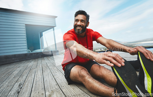 Image of Man, stretching legs and fitness, start running or race with smile, muscle and ready for exercise outdoor. Athlete, sports and cardio in nature, health and wellness, workout for marathon and warm up