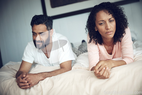 Image of Divorce, conflict and couple in bedroom for problem, frustrated and marriage fail with mental health risk. Thinking, fighting and woman with man, home and relationship issue with anxiety and stress