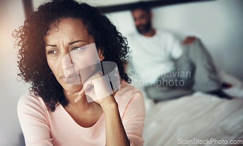 Image of Divorce, sad and couple in bedroom for problem, depression and marriage fail and mental health risk. Thinking, fight and woman with man, conflict and home depressed with anxiety, frustrated or stress