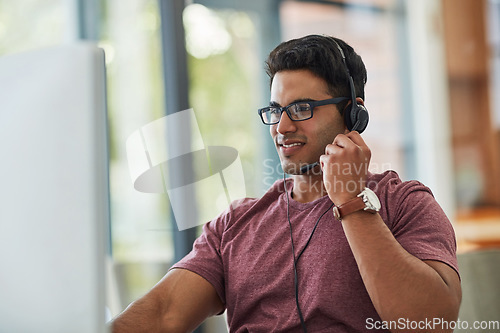 Image of Man, call center and computer in home office for technical support, virtual communication and online support. Remote consultant or agent in headphones for information technology, solution and advice