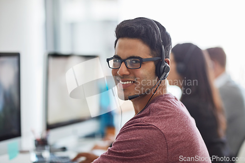 Image of Man, office and call center portrait for customer service, e commerce sales and telemarketing communication. Face of Mexican consultant or agent on computer, telecom workspace and contact or web chat