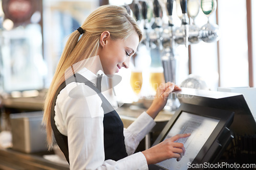 Image of Cashier, barista and young woman waitress in cafe checking for payment receipt. Hospitality, server and female butler from Canada preparing a slip at the till by a bar in coffee shop or restaurant.