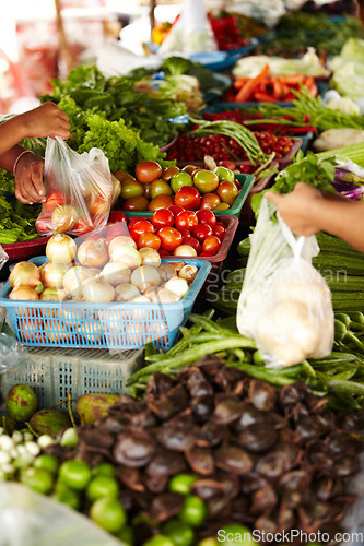 Image of Vegetables, local market and hands for shopping, trading goods and customer at food store or outdoor vendor. Seller, supplier or small business people with green product, garlic and sale for grocery