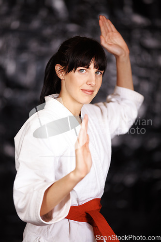 Image of Woman, karate and portrait, fight pose and self defense sport with muay thai and training. Athlete, combat and power with fitness, martial arts and energy with warrior, exercise and taekwondo