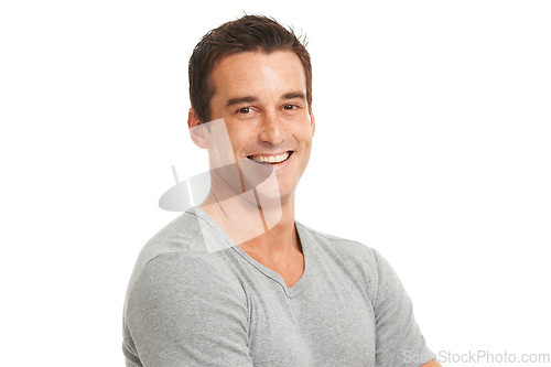 Image of Portrait, smile and a confident man in studio isolated on a white background for fashion or style. Happy, wellness and satisfaction with a young model looking relaxed in a casual clothes outfit