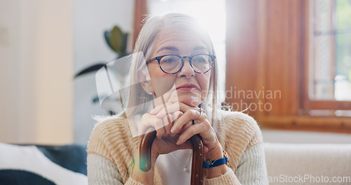 Image of Home, thinking and senior woman with depression, sad and retirement with memory, remember and anxiety. Mature person, elderly lady and pensioner with walking stick, alzheimer and mental health