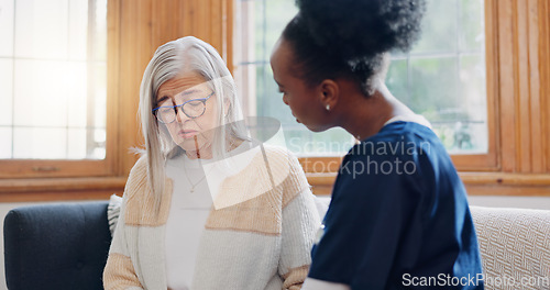 Image of Senior, sad woman or nurse with support or results in consultation for bad news or cancer disease. Stress, depression or caregiver with a crying mature patient for empathy, sympathy or help in home