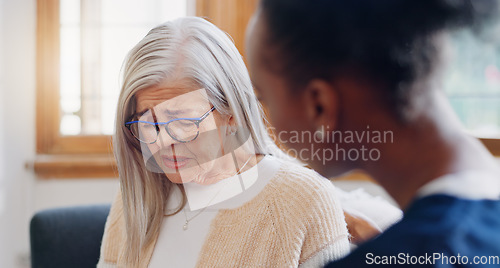Image of Senior, sad woman speaking or nurse with support or results in consultation for bad news or cancer. Stress, depression or caregiver with a crying mature patient for empathy, sympathy or help in home