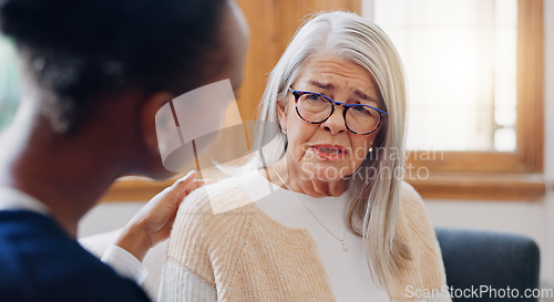 Image of Senior, sad woman speaking or nurse with support or results in consultation for bad news or cancer. Stress, depression or caregiver with a crying mature patient for empathy, sympathy or help in home