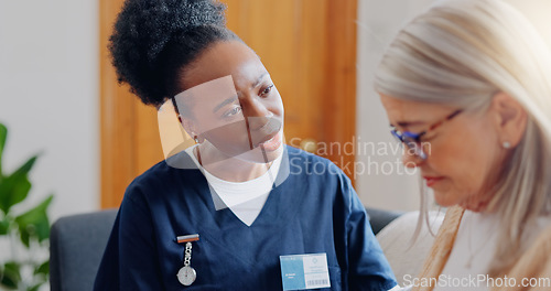 Image of Frustrated, sad woman speaking or nurse with results in consultation for bad news or cancer. Stress, lady talking or caregiver with a depressed mature patient for empathy, sympathy or help in home