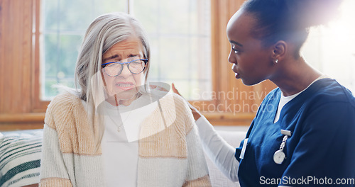 Image of Mature, sad woman or nurse with support or results in consultation for bad news or cancer disease. Stress, depression or caregiver with a crying senior patient for empathy, sympathy or help in home