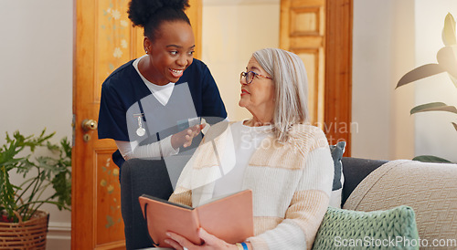 Image of Tablet, nurse and senior woman on sofa reading notebook for checklist consultation research checkup. Bond, healthcare and African female caregiver talk to elderly patient grocery shopping list letter