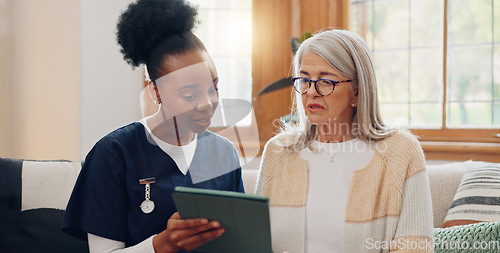 Image of Elderly, woman and nurse with tablet for consulting, medical information and communication with lens flare. Senior, professional or caregiver with touchscreen for online report, advisory and results
