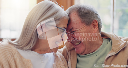 Image of Senior couple, happy and smiling with laugh and talking with embrace, couch and retired. Retirement, old age home and elderly in living room, couch and bonding together for quality time, hug or care