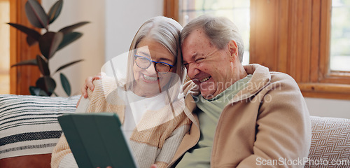 Image of Tablet, laugh and senior couple on a sofa watching a funny, comic or comedy video on social media. Happy, smile and elderly people in retirement scroll on mobile app or internet on digital technology