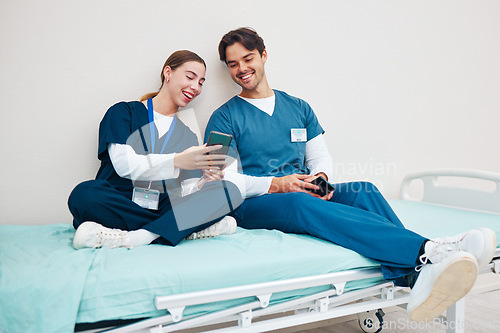 Image of Doctor, student phone and friends on break with laughing on a hospital, healthcare and clinic bed with social media. Smile, mobile and happy young people with rest from medical and nursing internship