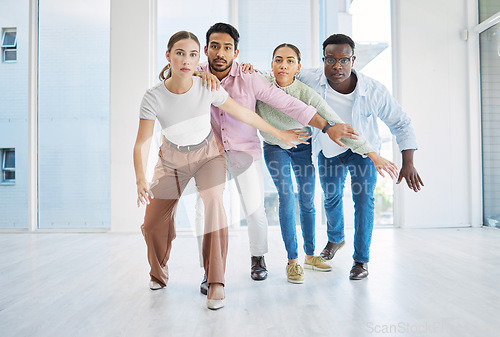 Image of Team building, startup and together for activity in office for collaboration, strategy or work. Diverse group, man and woman with serious, face and unity with pose for game, partnership or synergy