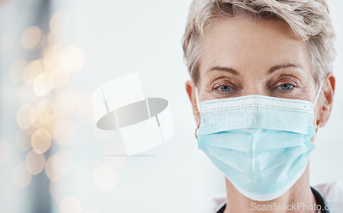 Image of Face mask, covid compliance and woman doctor in a hospital for health, safety and wellness with healthcare insurance. Portrait of female medical worker during covid19 pandemic in clean hospital