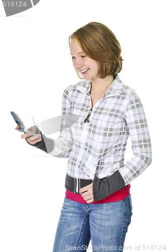 Image of Teenage girl text messaging on a cell phone