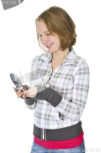 Image of Teenage girl text messaging on a cell phone