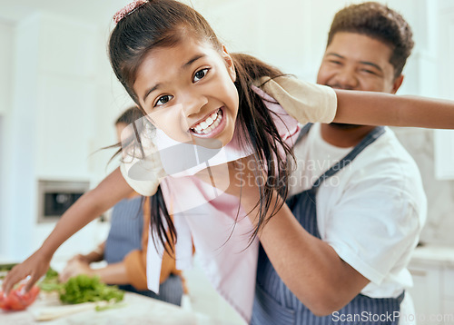 Image of Family, kitchen and cooking together, smile in portrait and father lift child, learning and chef skill with parents and kid. Happy, food preparation and meal, man holding child and mother with veg.