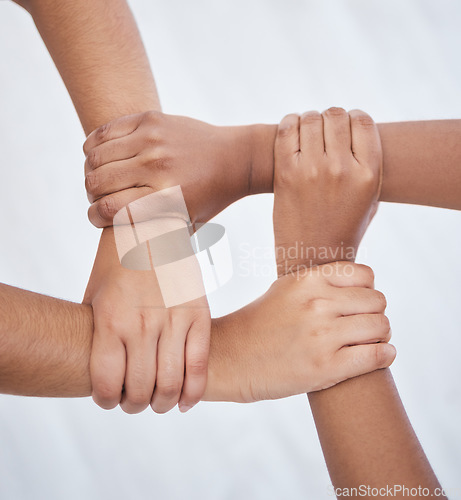 Image of Hands, collaboration and joined people holding hands for unity, solidarity and connection. Community, support and teamwork with colleagues working together. Union, partnership and motivated people