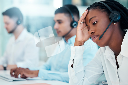 Image of Headache, call center and burnout with a black woman in telemarketing looking tired or exhausted. Consulting, compliance and customer service with mental health issues of a female crm representative