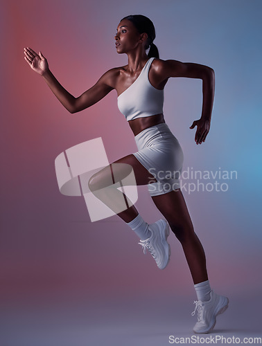 Image of Black woman, runner and exercise for health, wellness and workout with studio background. Female athlete, healthy trainer or focus for body warm up, running or training for cardio, fitness or balance