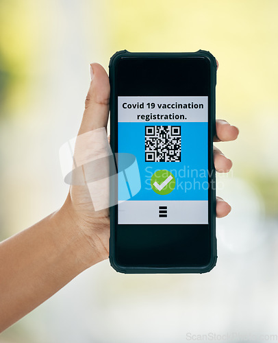 Image of Hand, vaccination and qr code on app on a phone for registration for travel safety or protection. Covid vaccine, barcode and digital certificate on cellphone for healthcare compliance during pandemic