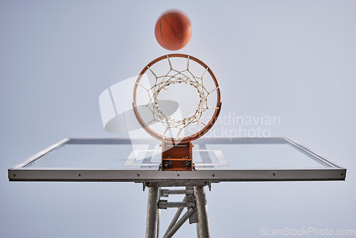 Image of Basketball, shooting ball and target of outdoor sports goals, competition game and action on sky background. Background basketball court, air net and winning contest, training skill and performance