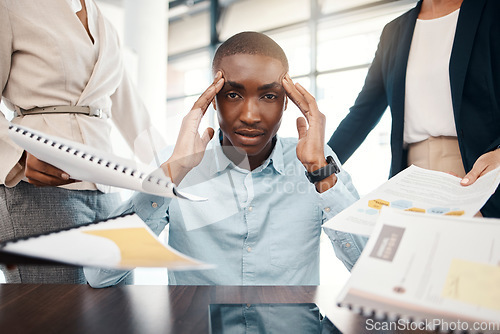 Image of Headache, overwhelmed businessman and work report stress in office with team. Black man, stressed business management leader and corporate mental health burnout or frustrated employee depression