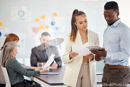 Image of Tablet, planning and meeting with a business team at work together in a boardroom before a planning discussion. Teamwork, technology and strategy with a man and woman employee group working online