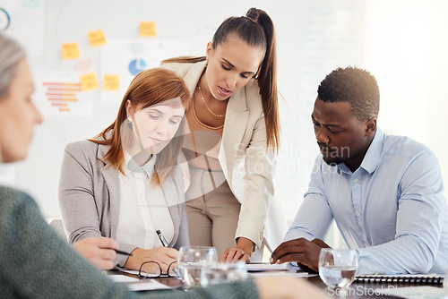 Image of Business people, financial and meeting in office with serious corporate workers planning, writing and preparing for audit. Finance, documents and busy group of employee rushing to meet a deadline