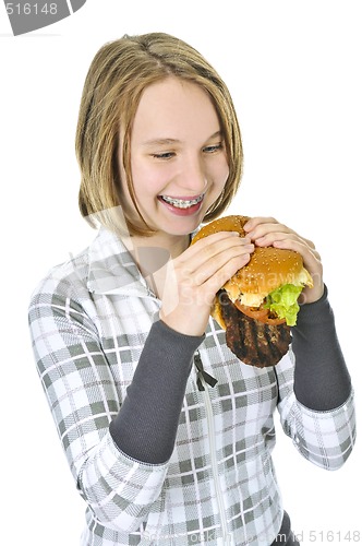 Image of Teenage girl holding big hamburger