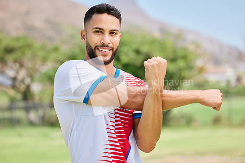 Image of Fitness, portrait and soccer player stretching in training, workout and warm up exercise on a soccer field. Smile, healthy and happy sports man ready to start playing a football match or game in Peru