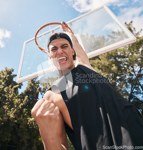 Image of Basketball, man and winner in score for sports game, celebration or match in the court outdoors. Excited, energetic male basketball player celebrating victory dunk or sport success for point outside