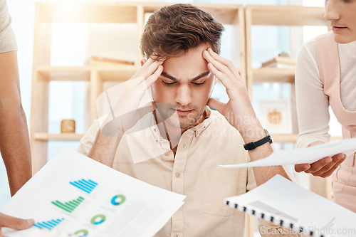 Image of Stress, young man and headache being overworked, upset and tired in office. Business, employee and male experience burnout, frustrated and depressed with multiple task with anxiety and mental health.