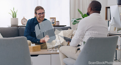 Image of Black man, talking psychologist and patient on mental health support sofa, anxiety consulting or depression counseling. Smile, happy and trust in psychology counselling therapy or rehabilitation help