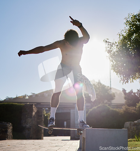 Image of Skateboard, ramp and young man doing a trick at an outdoor park for fun, fitness or training. Adventure, freedom and athlete or skater doing a extreme sports stunt in nature in a urban street.
