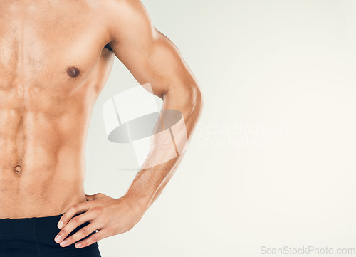 Image of Muscular, man and fitness in studio zoom in for health, wellness and muscle in studio background with mockup space. Stomach, skincare and guy model torso for six pack, beauty and grooming or mock up